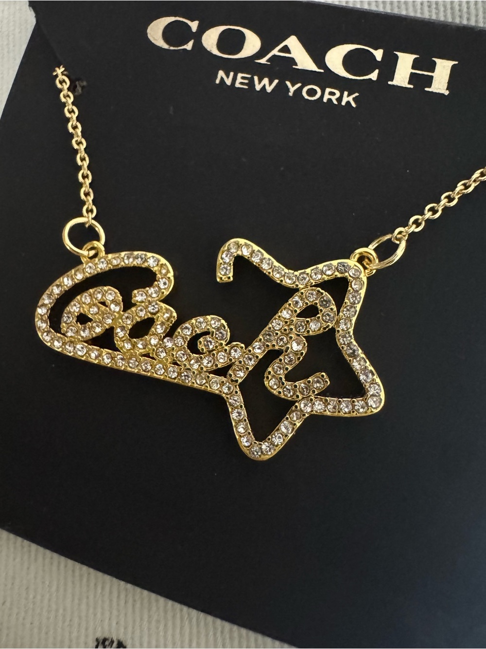 Coach Gold-Tone Crystal 'Coach' Star Pendant Necklace
